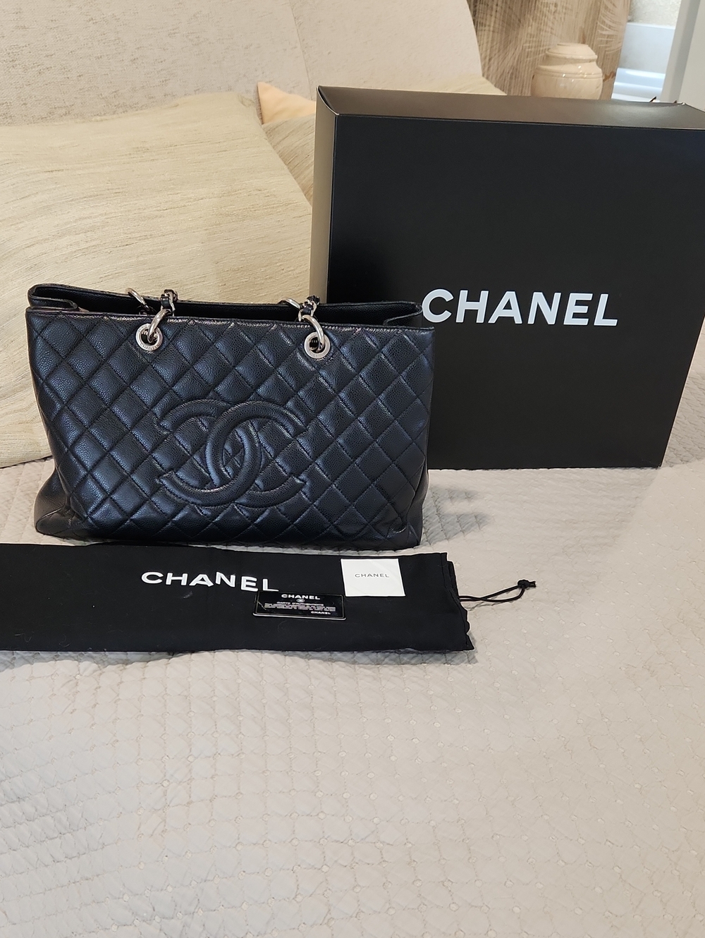 CHANEL Black Quilted Leather Shoulder Bag with CC Emblem